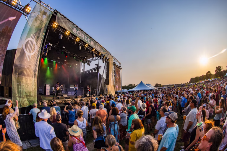 Crowd beside the Borderland Festival stage at sunset in 2024, photographed by Jesse Faatz.