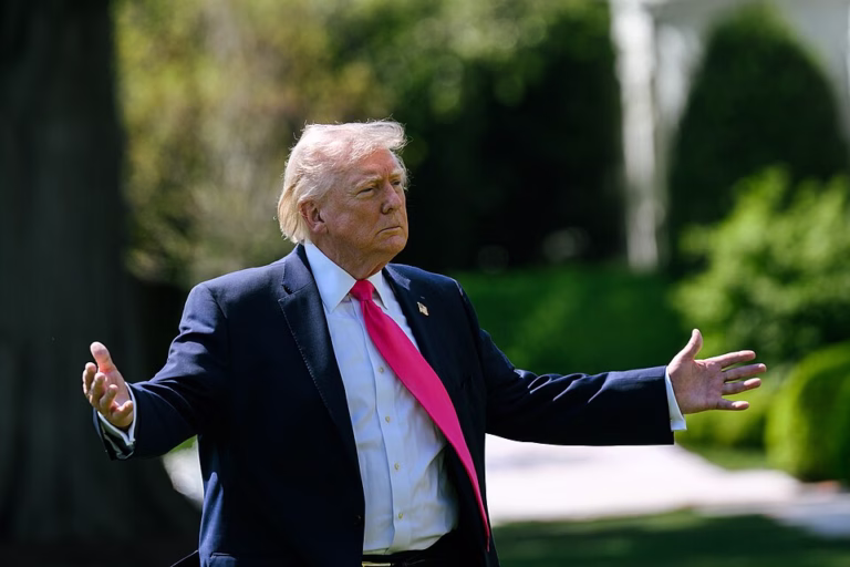 The president speaking with reporters on the White House South Lawn before boarding Marine One